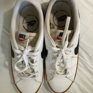 Nike Kids White Sneakers with Black Swoosh and Gum Trim